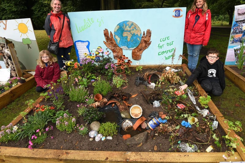 from left, Lorien Crowther, nine, Marian Heneghan, Julie Taylor and Connor O'Brien, ten, with their themed display showing how the world could look if we look after it and how it could be if we don't, from St Joseph's Catholic Primary School.