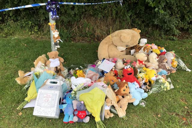 Tributes left in Pandy Park in Bridgend, south Wales, near to where a five-year-old boy was found dead in the Ogmore River on Saturday.