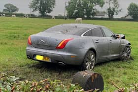 Police are at the scene of a crash near Longridge this morning (Tuesday, August 10) where a Jaguar has ploughed through a fence and into a field