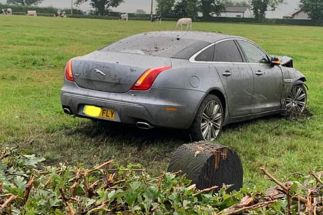 Police are at the scene of a crash near Longridge this morning (Tuesday, August 10) where a Jaguar has ploughed through a fence and into a field