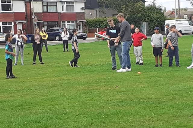 The 43-year-old met with volunteers to learn about the important work they are doing in the community and invited youngsters to an impromptu game of cricket on nearby St John's Green on the Broadfield estate in Leyland. Pic: The Base