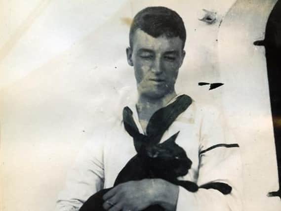 Sailors regard black cats as lucky (unknown sailor and cat). Picture courtesy of Stuart Clewlow
