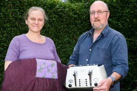 Jennifer and Patrick Randolph-Quinney with a patched-up bedspread and resurrected toaster courtesy of Preston's repair café (image: Kelvin Stuttard)