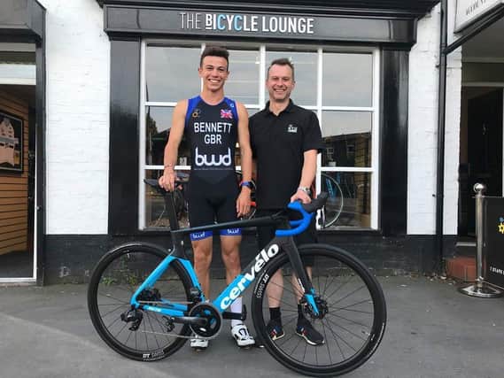 Matt Middleton, owner of The Bicycle Lounge, with triathlete Ethan Bennett, whom they sponsor