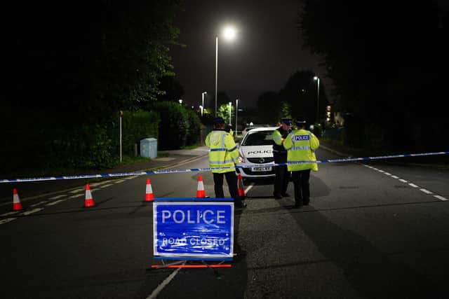A police cordon on Royal Navy Avenue, near the scene of an incident in the Keyham area of Plymouth, where Devon and Cornwall Police say there have been a "number of fatalities" in a "serious firearms incident".