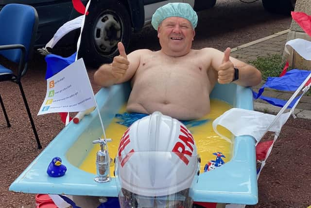 Martyn Browitt in his custard bath giving the thumbs up!