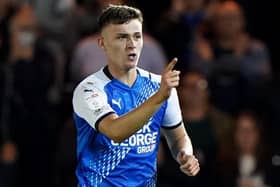 Peterborough United’s Harrison Burrows celebrates scoring the opening goal in Tuesday’s 2-2 draw with Cardiff