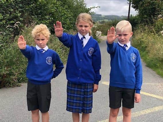 : St Mary and St Michael pupils Lewis, Lacey and Logan join the protest