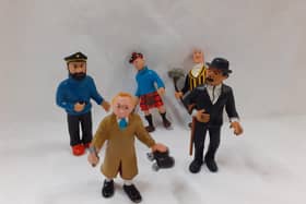 These figurines are from a collection currently in the centre, averaging around six pounds for the more common ones. The rarer Tintin in a brown coat holding a gun and binoculars is nine pounds