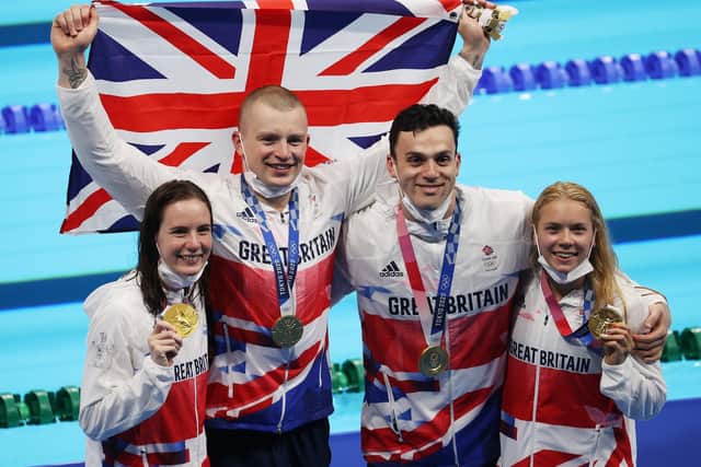 Gold medalists Kathleen Dawson, Adam Peaty, James Guy  and Anna Hopkin  pose  after the medal ceremony for the Mixed 4 x 100m Medley Relay Final - Picture Getty Images
