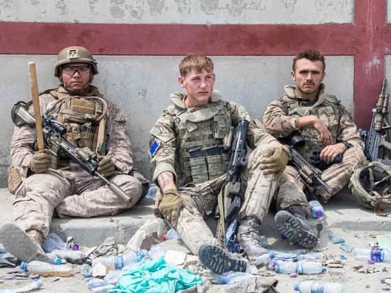 Members of the British and US military engaged in the evacuation of people out of Kabul, Afghanistan