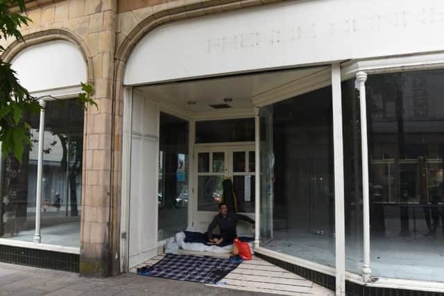 The former French Connection store sits empty on the corner of the Miller Arcade