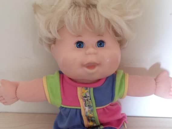 This Cabbage Patch doll has clearly been loved, but still has plenty of hugs left in them