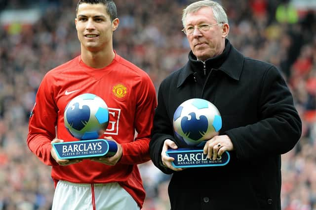 Manchester United's Alex Ferguson and Cristiano Ronaldo receive their manager and player of the month trophies in 2008