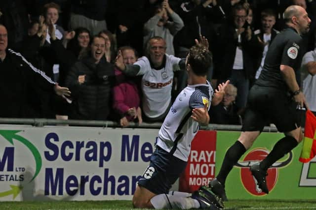 Ryan Ledson celebrates with the fans after scoring against Morecambe