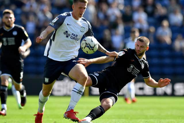 Preston’s Emil Riis battles with Swansea City’s Brandon Cooper