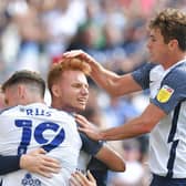 Sepp van den Berg is congratulated by Preston team-mates Emil Riis and Ryan Ledson after scoring against Swansea