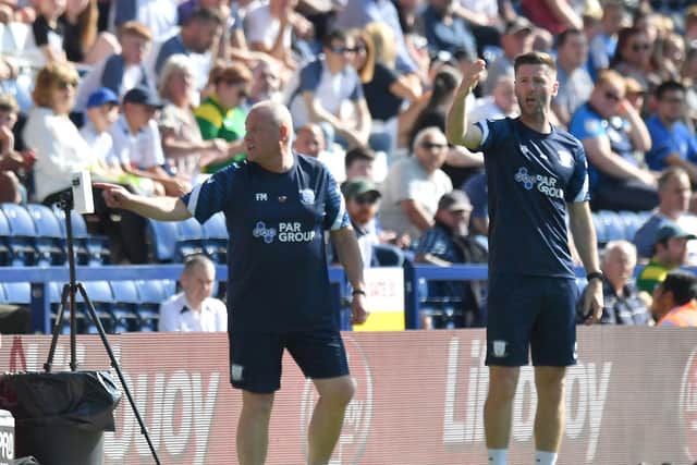 Preston North End head coach Frankie McAvoy and coach Paul Gallagher during the win against Swansea City at Deepdale