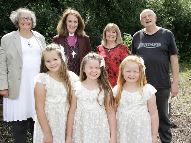 Bishop Jill (back row centre left) and Sharon Collins (back row centre right), are pictured with the baptism and confirmation candidates