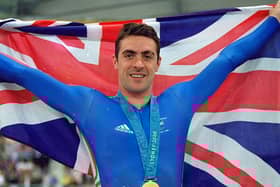 Jason Queally flies the flag for Great Britain after winning gold in the Men's 1km Time Trial final at the Dunc Gray Velodrome during Day One of the Sydney 2000 Olympic Games  Picture: Getty Images