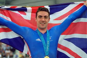 Jason Queally flies the flag for Great Britain after winning gold in the Men's 1km Time Trial final at the Dunc Gray Velodrome during Day One of the Sydney 2000 Olympic Games  Picture: Getty Images