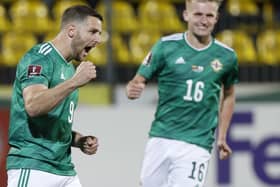 Preston North End new boy Ali McCann (No.16) goes to congratulate Connor Washington during Northern Ireland's 4-1 win in Lithuania