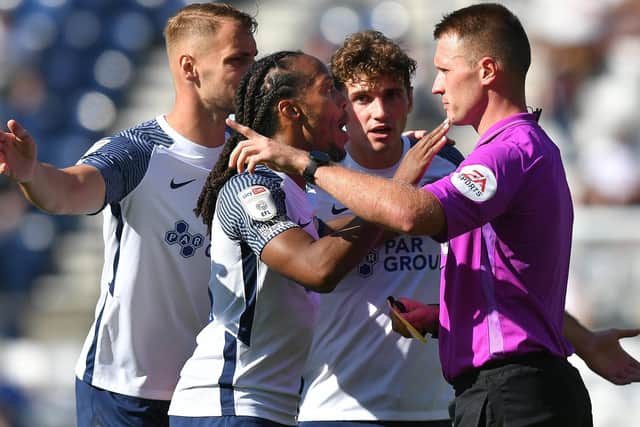 Patrick Bauer, Daniel Johnson and Ryan Ledson remonstrate with referee Thomas Bramall during PNE's win over Swansea at Deepdale