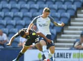 Preston North End striker Emil Riis takes on a Swansea defender at Deepdale