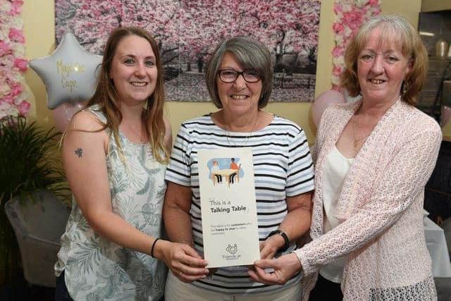 Marjorie Hayward (centre) at the launch of Talking Tables in Chorley in July
