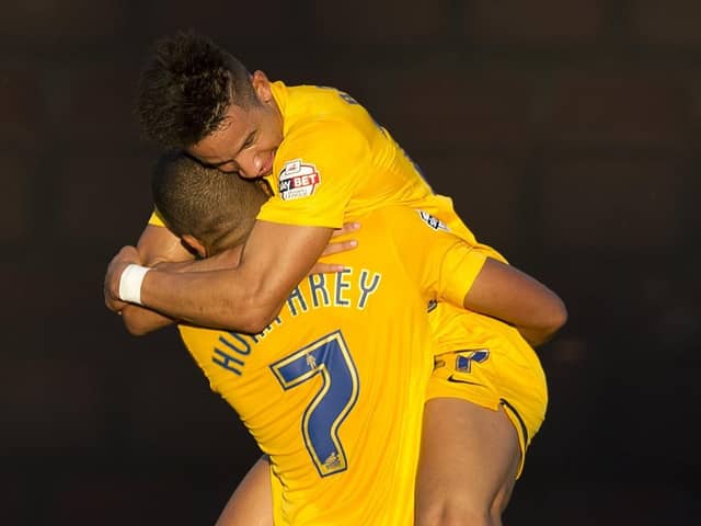 Callum Robinson gets a lift from Chris Humphrey after scoring for PNE