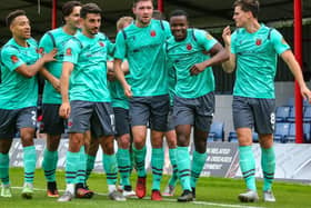 Chorley ace Millenic Alli (second right) is congratulated by his team-mates after hitting the winning goal against Alfreton (photo: Stefan Willoughby)