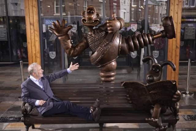 Nick Park relaxes on the new Wallace and Gromit bench.