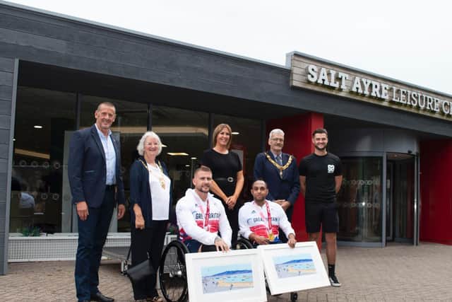 Stuart Robinson and Ayaz Bhuta being congratulated on their gold medals by Kevin Nicholls, Margaret Greenall (Mayoress of Lancaster), Rachel Williams (Salt Ayre manager), Councillor Mike Greenall (Mayor of Lancaster) and Kyle Lewis (duty manager).