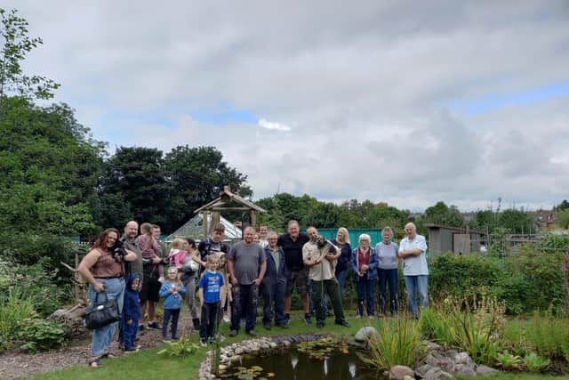 Plot holders and their families and friends at the official opening of the Serpentine 3 wildlife garden