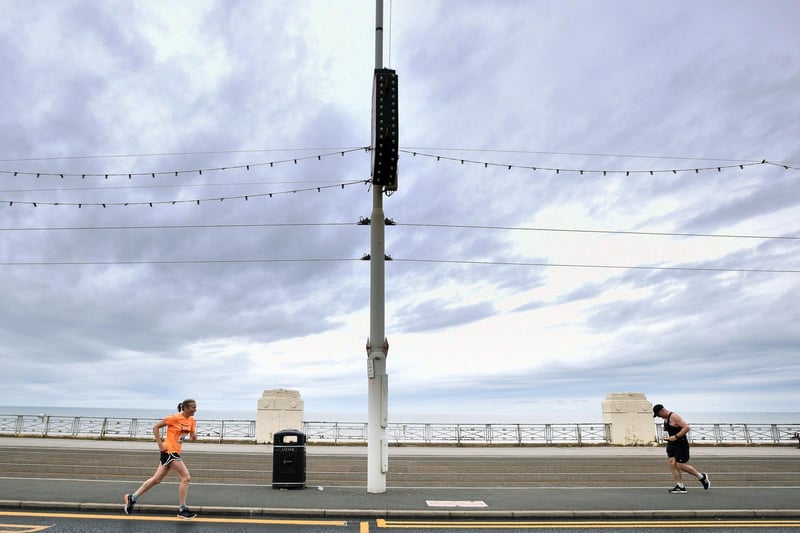 Runners take part in the Blackpool Half and full marathon along the promenade in Blackpool on Sunday.