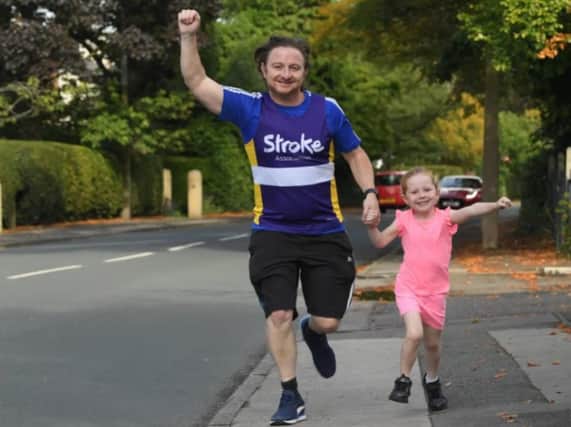 Alice in training with her dad for the Longton run.