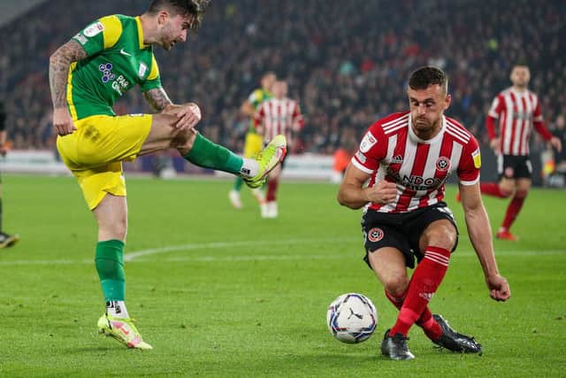 North End striker Sean Maguire has a shot blocked against Sheffield United