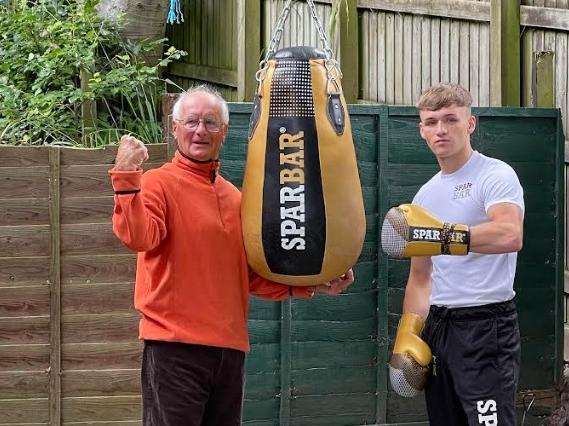 Bob gives grandson Louis some tips in the garden gym.
