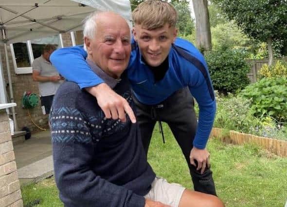 Proud as punch: Bob and his boxing grandson Louis.