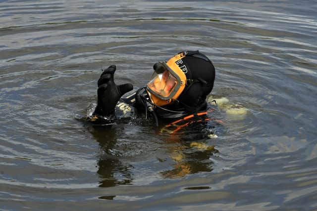 Divers have been delving into the lake in Astley Park (image: Neil Cross)