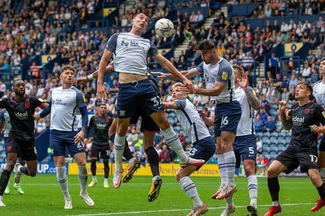 Preston defenders Josh Earl and Andrew Hughes are in the thick of the action as they defend against West Brom