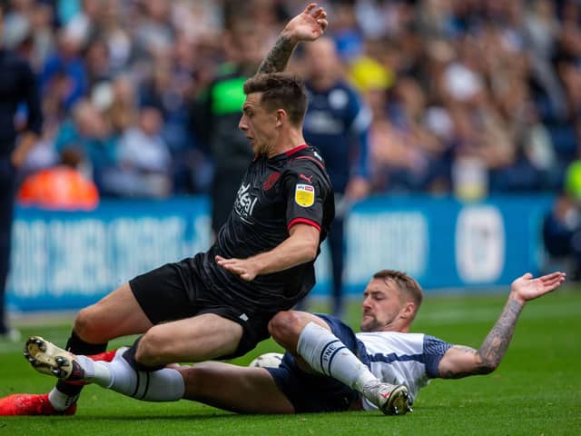 Preston North End defender Patrick Bauer tackles West Bromwich Albion's Jordan Hugill at Deepdale