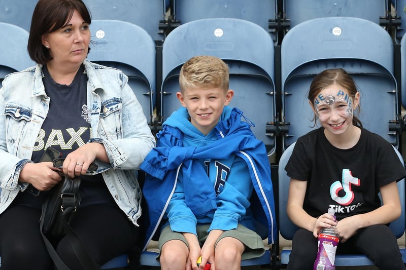 Three PNE fans get ready to watch their side in action