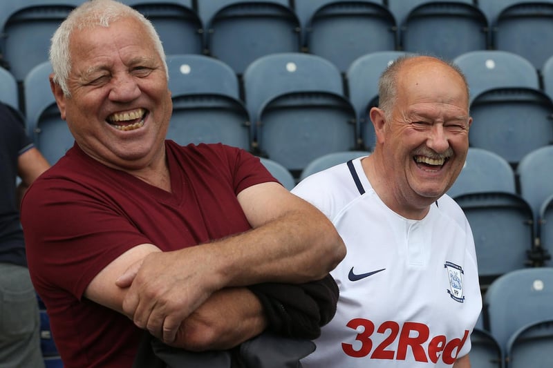 Two North End supporters are in upbeat mood at Deepdale