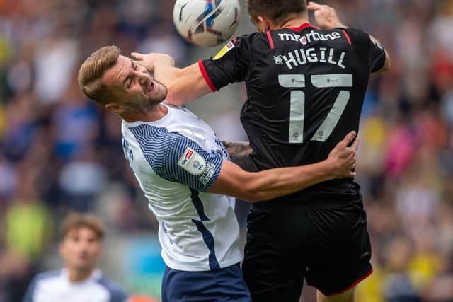 Preston North End centre-half Patrick Bauer takes a painful blow in the face from West Bromwich Albion's Jordan Hugill