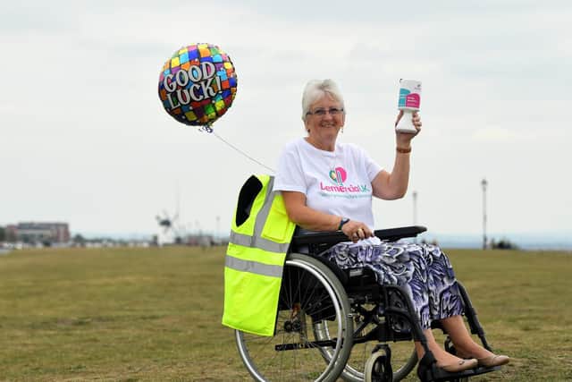 June Doyle during her wheelchair push  from The Clifton pub in Warton to the Sandcastle Blackpool