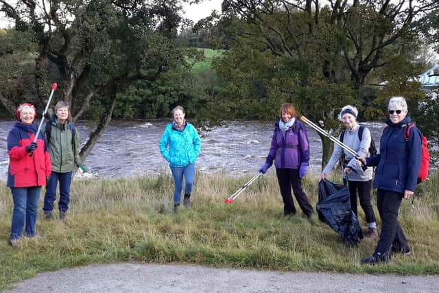Members of the Longridge Environment Group litter picking by the banks of the Ribble.