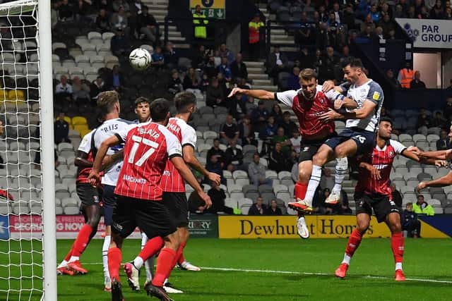 Andrew Hughes heads Preston North End in front against Cheltenham at Deepdale