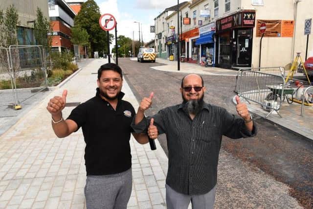 Irfan Mehmood and Idris Hansrot celebrate the reopening of Adelphi Street in Preston