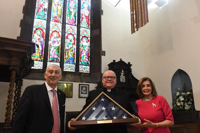 Sir Lindsay Hoyle with rector of St Laurence’s Church, Chorley, the Father Neil Kelley, receiving an American flag from Nancy Pelosi, Speaker of the US House of Representatives during the G7 Speakers Conference in Chorley.
Photo: Jessica Taylor